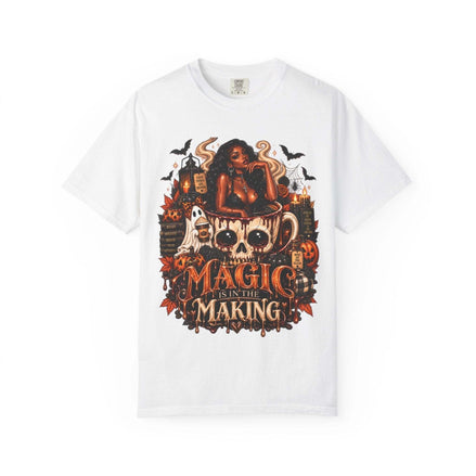Unisex Garment-Dyed T-shirt in white with a detailed Halloween graphic featuring a woman, skull coffee mug, ghosts, bats, pumpkins, and candles