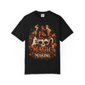 Unisex Garment-Dyed T-shirt in black with detailed Halloween graphic featuring a witchy woman, skull mug, ghosts, pumpkins, and candles