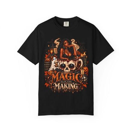Unisex Garment-Dyed T-shirt in black with detailed Halloween graphic featuring a witchy woman, skull mug, ghosts, pumpkins, and candles